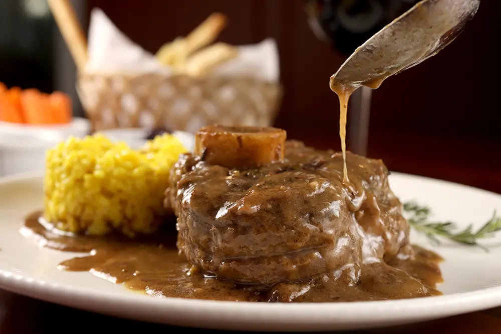 Prato OSSOBUCO CON RISOTTO ALLA MILANESE